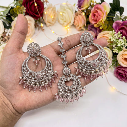 silver and baby pink earrings tikka set