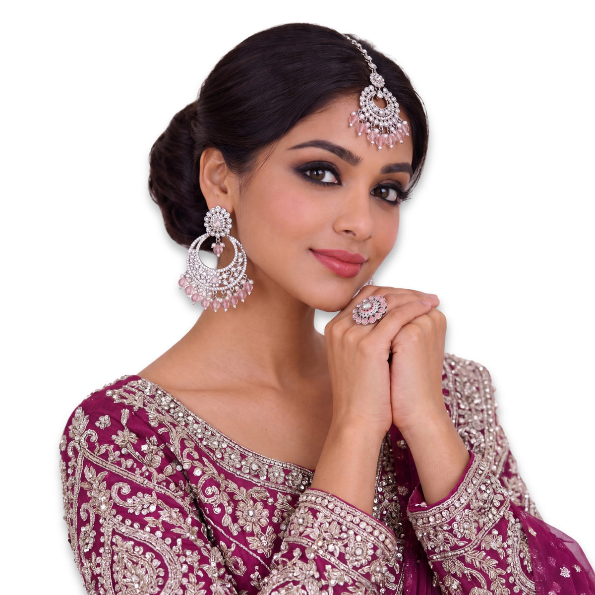 silver and baby pink earrings tikka set