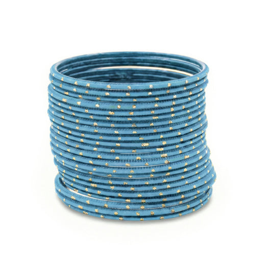 Light blue bangles with golden dots churi set stacked together showing slim elegant Indian jewellery design indian jewellery