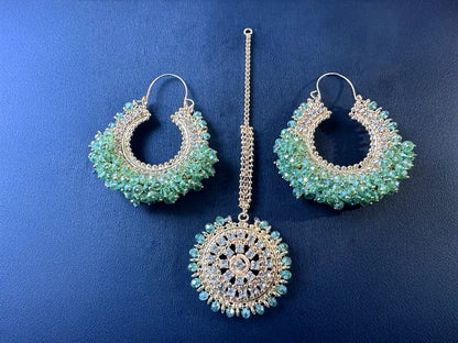 Light green chand bali earrings and tikka set on a dark background - Trending pakistani earrings tikka. 