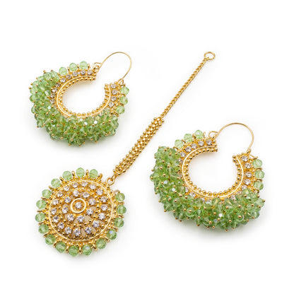 mint green chand bali earrings and maang tikka set on a white background - Trending pakistani jewellery. 