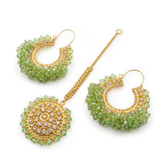 mint green chand bali earrings and maang tikka set on a white background - Trending pakistani jewellery. 