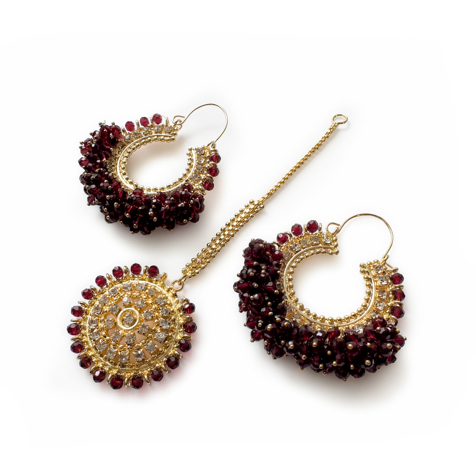 Maroon chand bali earrings and maang tikka set on a white background - Trending pakistani jewellery. 