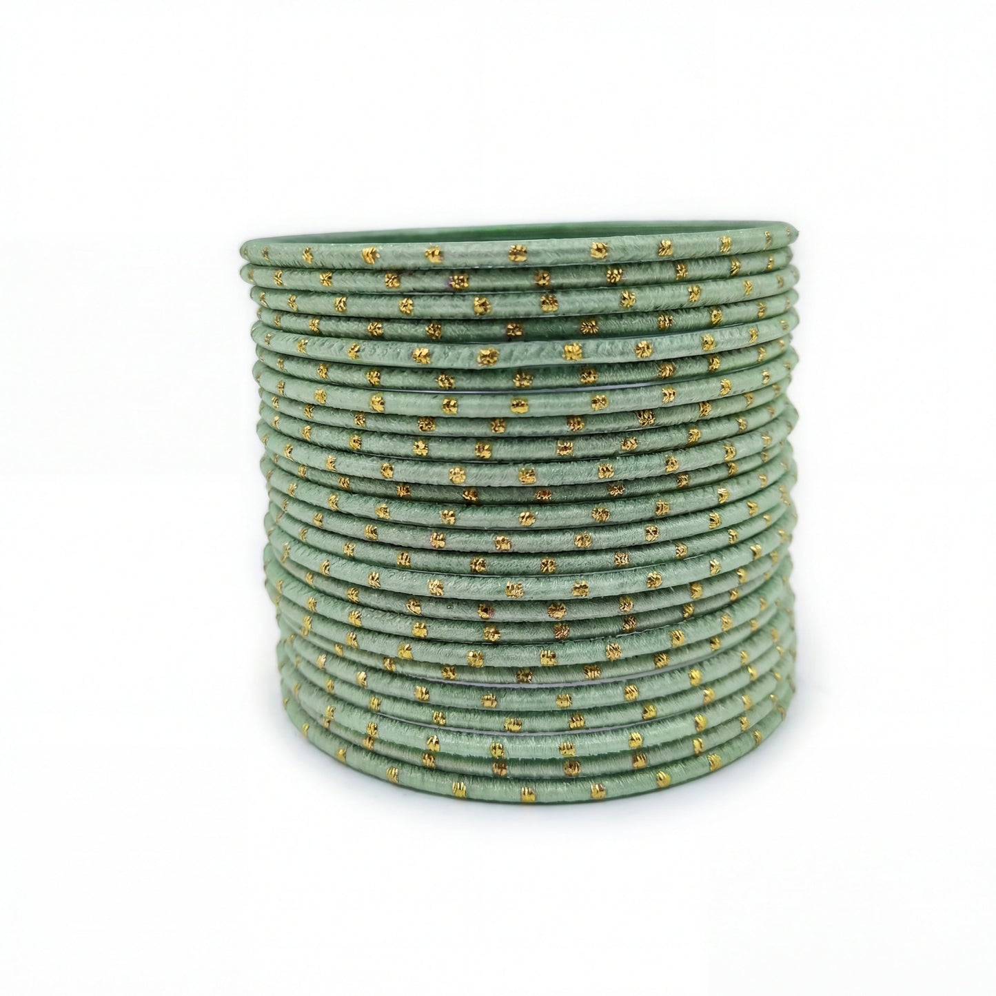 mint green bangles with golden dots churi set arranged together showing slim elegant indian jewellery design indian jewellery