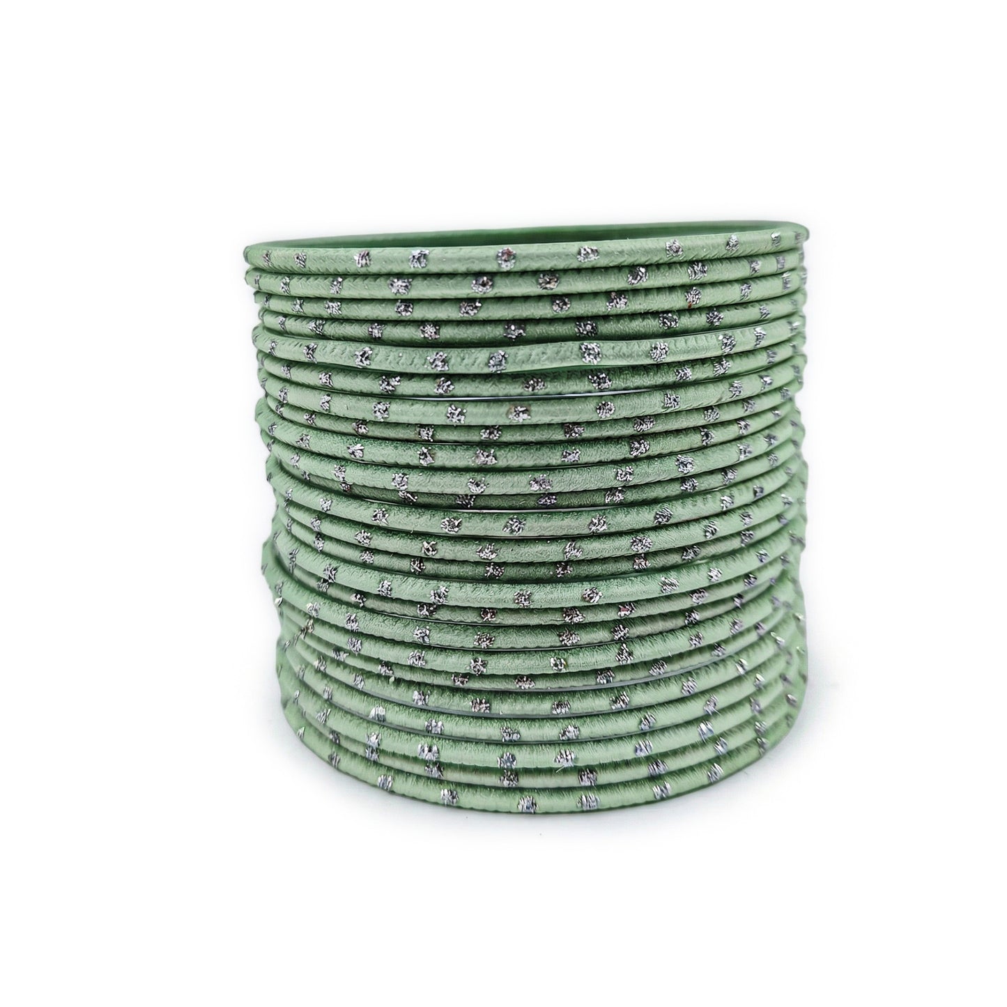 mint green bangles with silver dots churi set arranged together showing slim elegant indian jewellery design indian jewellery
