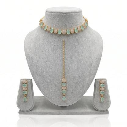 Mint Green Choker Set with Earrings & Maang Tikka on a grey jewellery display