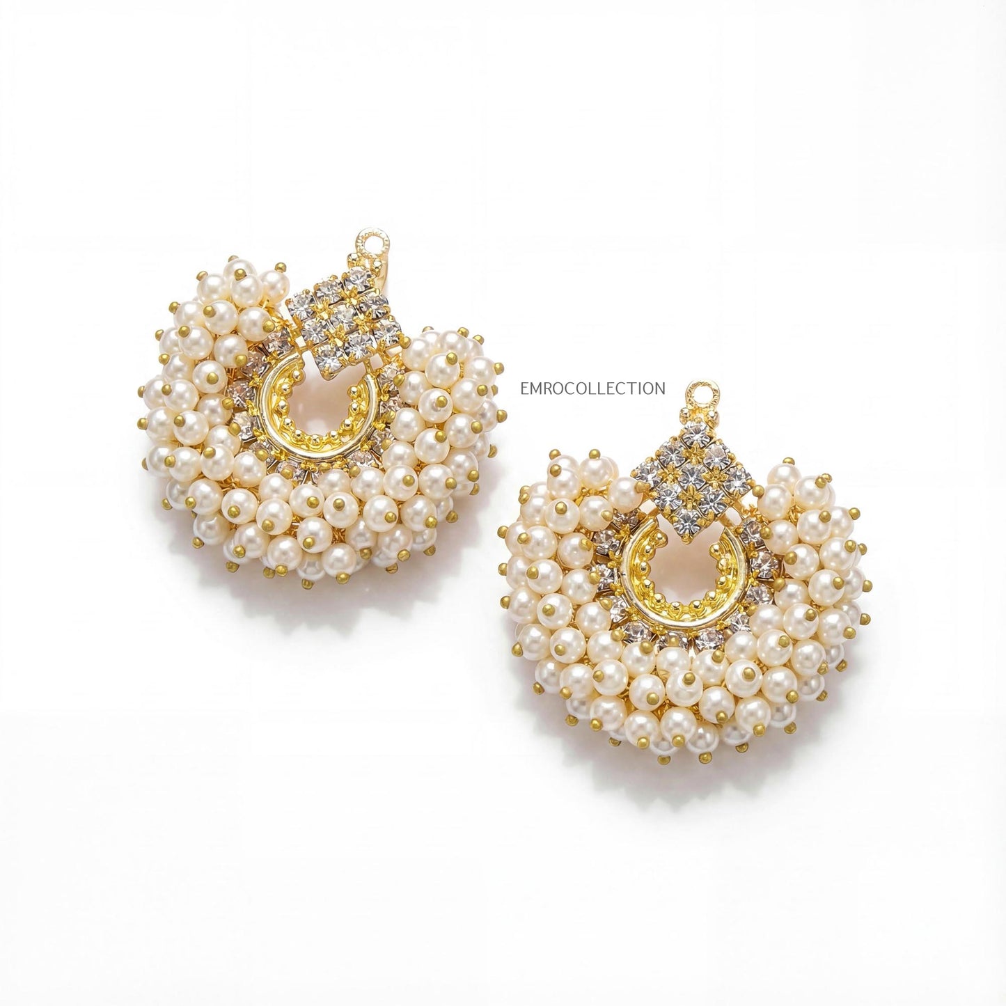 pair of off white pearl and gold earrings on a white background - trending pakistani earrings tikka set