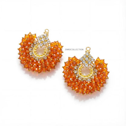 pakistani jewellery - Orange chand bali earrings tikka on a white background