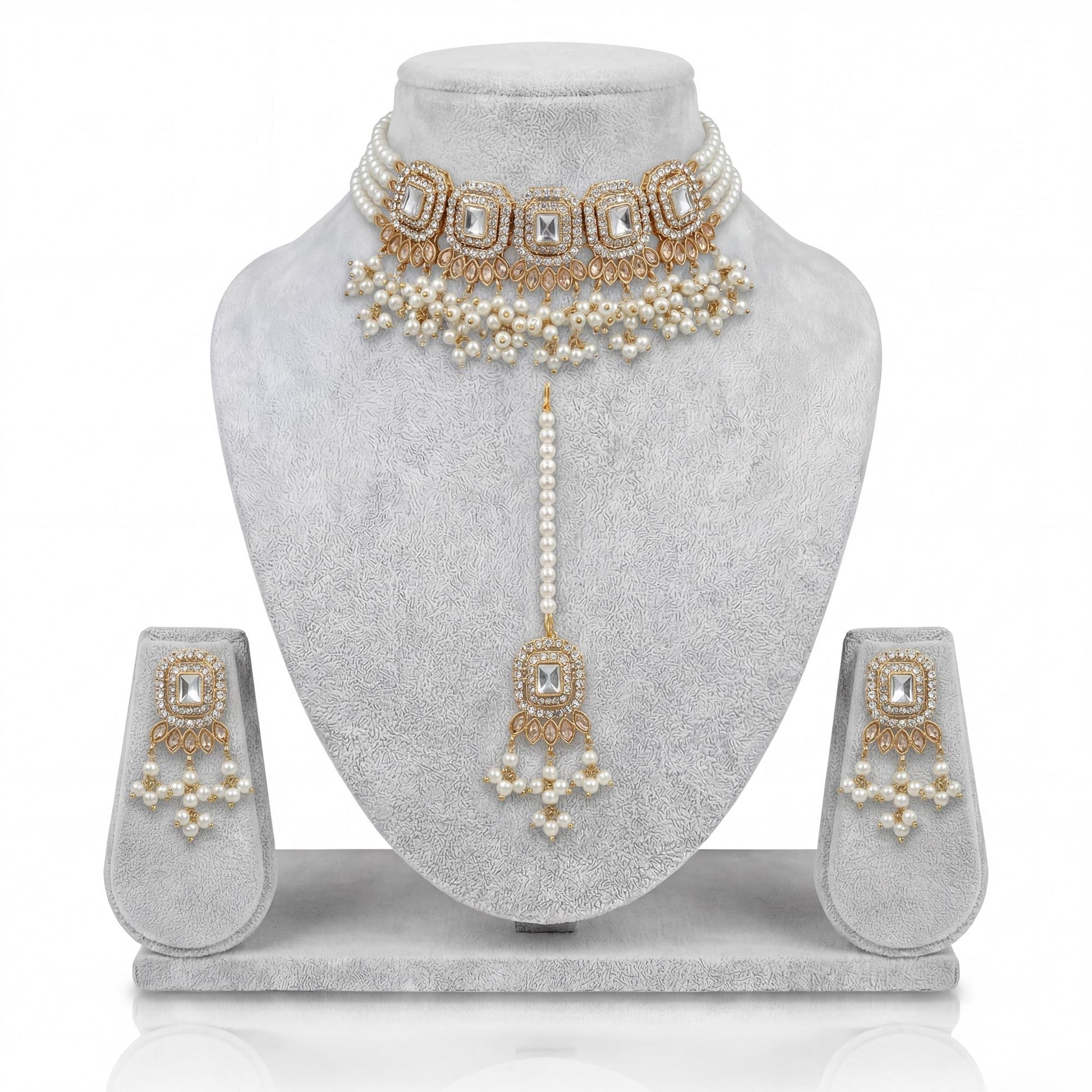 Off white pearl choker set displayed on light grey velvet dummy showing elegant pakistani jewellery craftsmanship