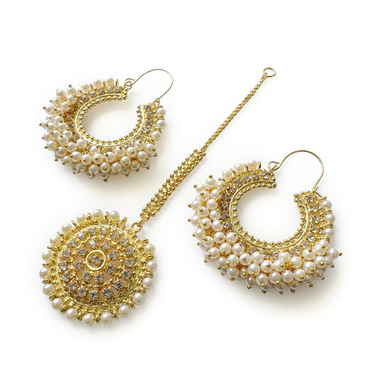 Pearl Chand Bali earrings with Maang Tikka on a white background. trending pakistani jewellery