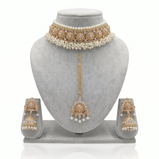 Pearl Choker Set with Earrings & Maang Tikka on a grey jewellery display