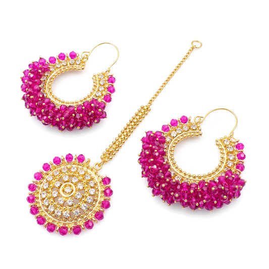 Shocking pink Chand Bali earrings with Maang Tikka on a white background. trending Pakistani jewellery