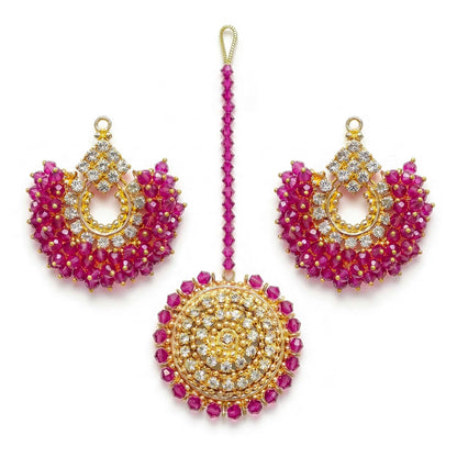 Shocking pink chand bali earrings and maang tikka on a white background - trending pakistani jewellery