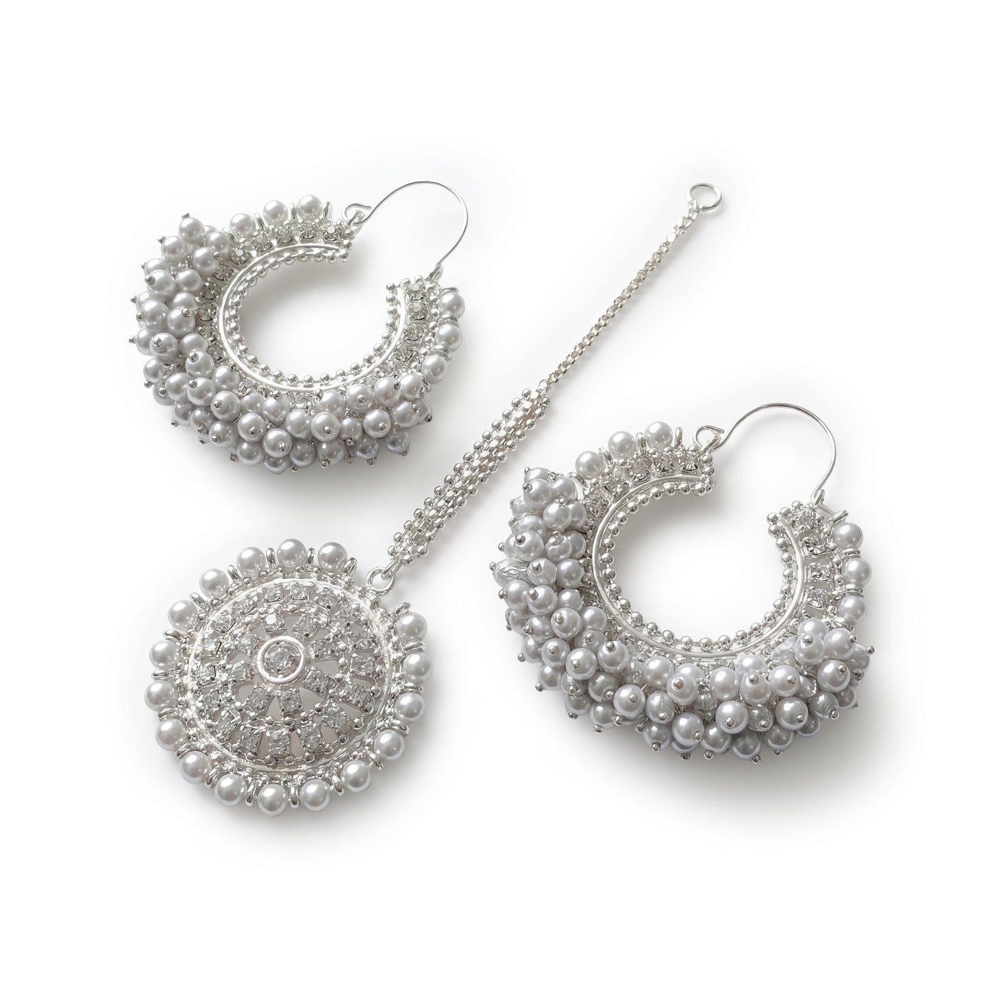 classic silver white chand bali earrings maang tikka on a white display. pakistani trending earrings tikka
