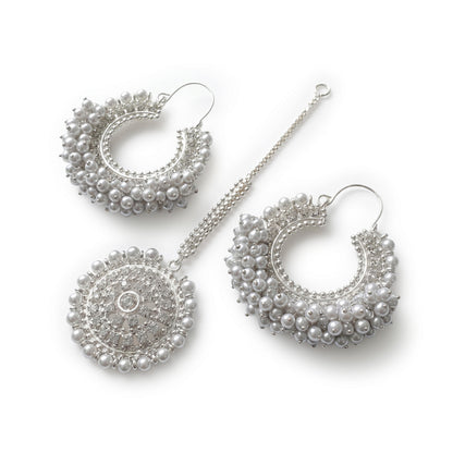 Classic silver white Chand Bali earrings Maang Tikka on a white display. pakistani trending earrings tikka