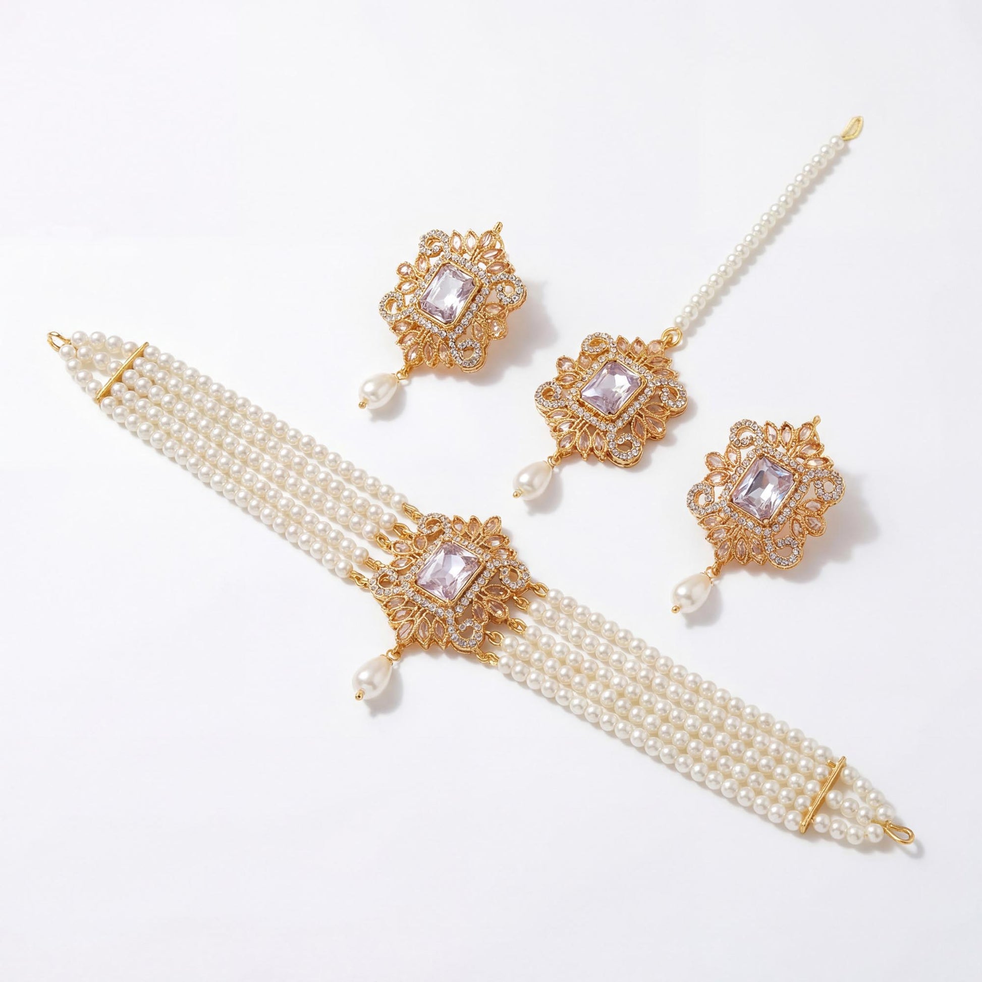 Off white pearl choker set with earrings and tikka displayed on pure white background premium pakistani jewellery set