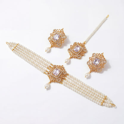 Off white pearl choker set with earrings and tikka displayed on pure white background premium pakistani jewellery set