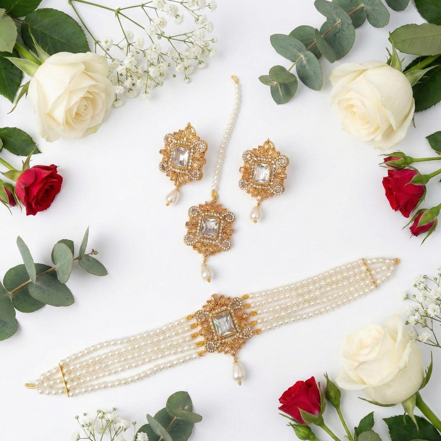 simple off white pearl choker jewellery set arranged on clean white background with flowers elegant pakistani jewellery look