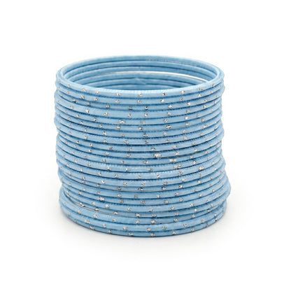 Sky blue bangles with silver dots churi set stacked together showing slim elegant Indian jewellery design indian jewellery
