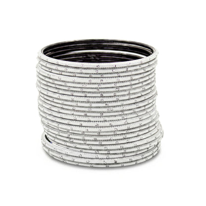 Close-up of white bangles with silver dots stack highlighting polished finish and bridal Indian jewellery craftsmanship indian jewellery